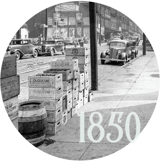 strip district sidewalks with wooden boxes and barrels, and the text '1850'