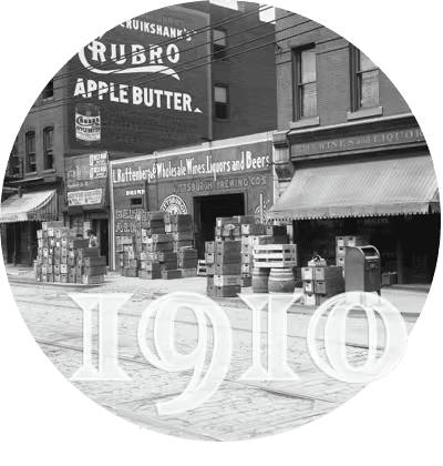 the Strip District Terminal building in 1910, with a wall advertisement for Crubo Apple Butter