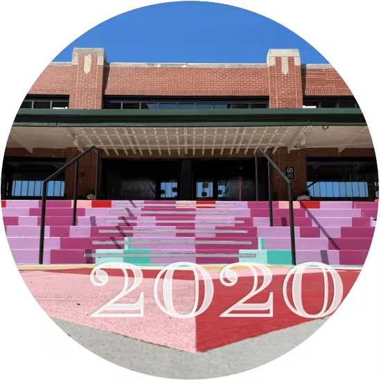 the front of the Strip District Terminal Building in 2020, with a colorful front railing display